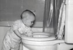 Photo of Robb Lightfoot as an infant fishing around in a toilet bowl. This may be bad, but realize that someone stood there with a camera, taking this picture, before -- I hope -- he was stopped. But who knows. He may still be there.