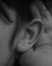 Image of a hand cupped behind and ear
